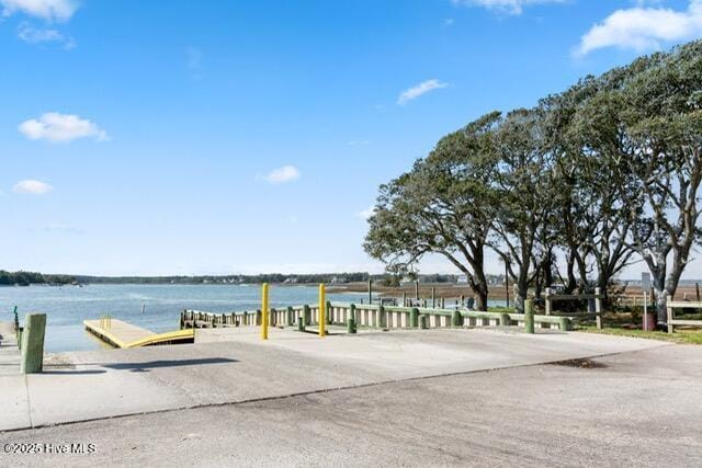 660 Beachview Dr SE, Bolivia, NC 28422 - dock area with a water view and a boat ramp
