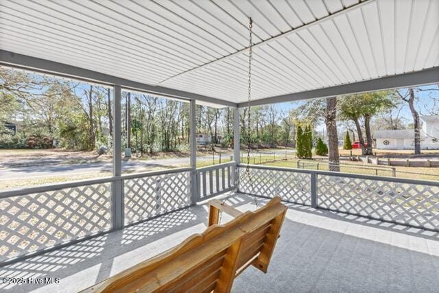 660 Beachview Dr SE, Bolivia, NC 28422 - unfurnished sunroom with plenty of natural light