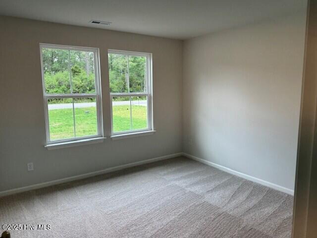 1120 Goldsboro Rd, Boiling Spring Lakes, NC 28461 - carpeted empty room featuring baseboards