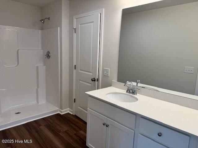 1120 Goldsboro Rd, Boiling Spring Lakes, NC 28461 - bathroom with wood finished floors, vanity, and a shower
