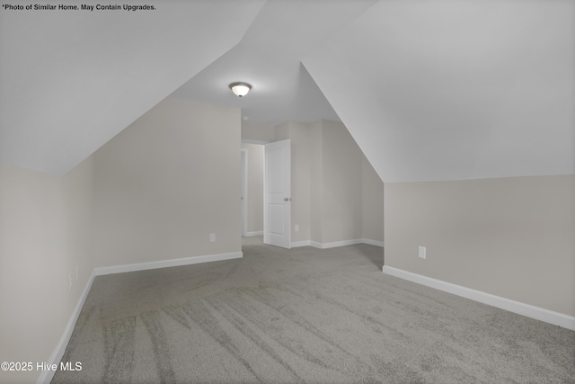 157 Tides End Dr, Holly Ridge, NC 28445 - additional living space with lofted ceiling, carpet flooring, and baseboards