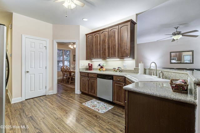 203 Abbey Ln, Wilmington, NC 28411 - kitchen with appliances with stainless steel finishes, ceiling fan, a sink, and wood finished floors