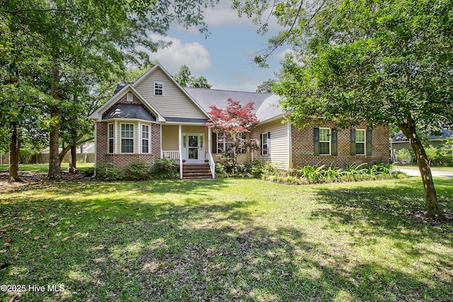 203 Abbey Ln, Wilmington, NC 28411 - view of front of home featuring brick siding, a front yard, and covered porch
