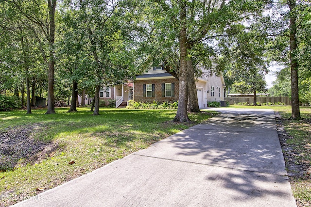 203 Abbey Ln, Wilmington, NC 28411 - view of property hidden behind natural elements with driveway and brick siding
