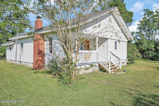 159 Shady Lane Rd, Willard, NC 28478 - back of property with a chimney, crawl space, a lawn, and a porch