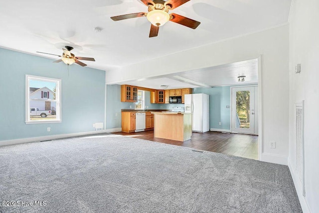 159 Shady Lane Rd, Willard, NC 28478 - unfurnished living room featuring dark carpet, ceiling fan, and baseboards