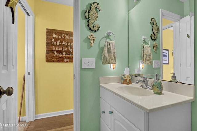 53 N Ridge Ln, Surf City, NC 28445 - bathroom with vanity, wood finished floors, and baseboards