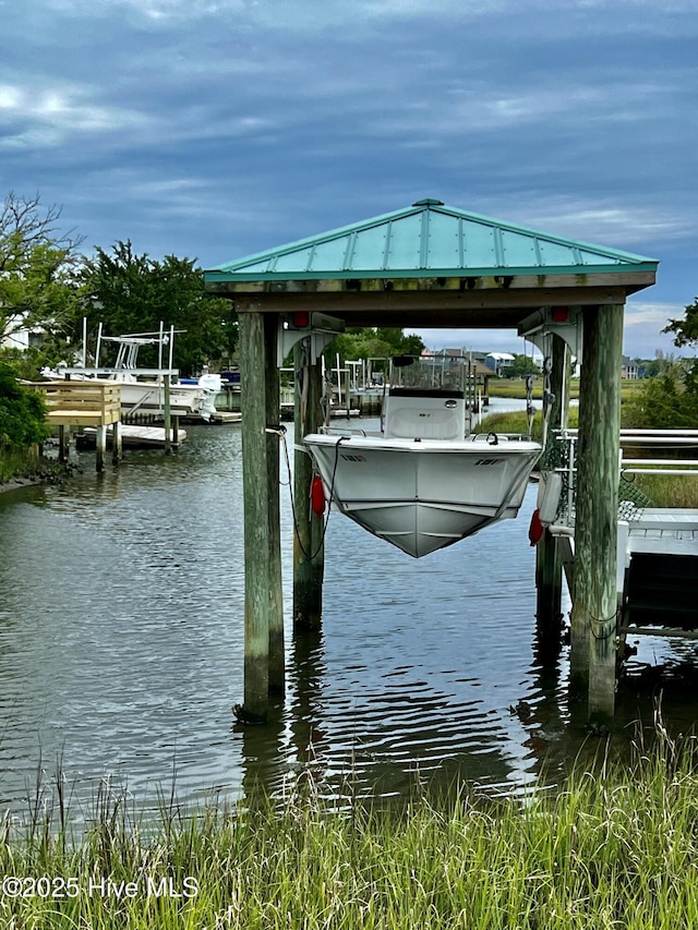 53 N Ridge Ln, Surf City, NC 28445 - dock area with boat lift and a water view