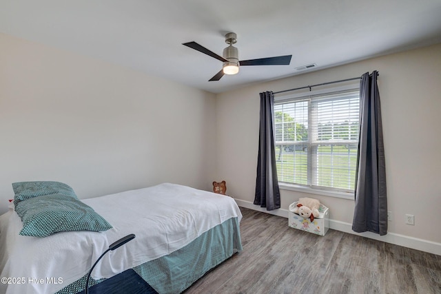176 Lewis Rd, Hampstead, NC 28443 - bedroom with wood finished floors, baseboards, and ceiling fan