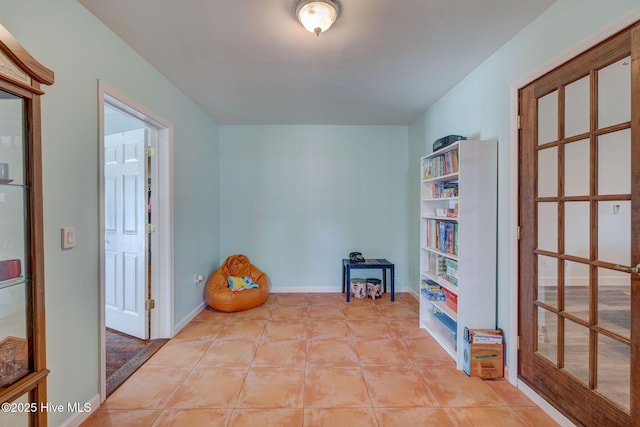 176 Lewis Rd, Hampstead, NC 28443 - living area featuring light tile patterned flooring and baseboards
