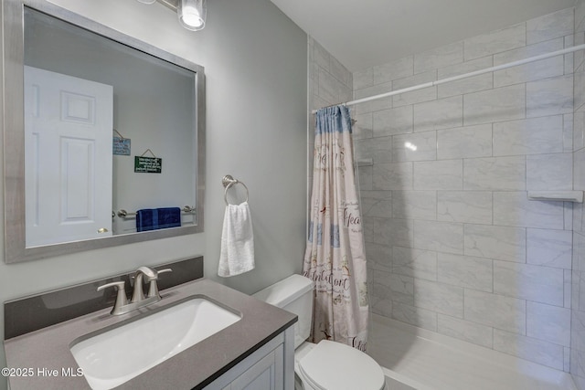 176 Lewis Rd, Hampstead, NC 28443 - full bath featuring toilet, vanity, and tiled shower