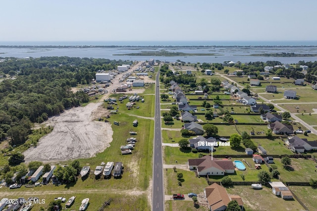 aerial view of property's location featuring a large body of water