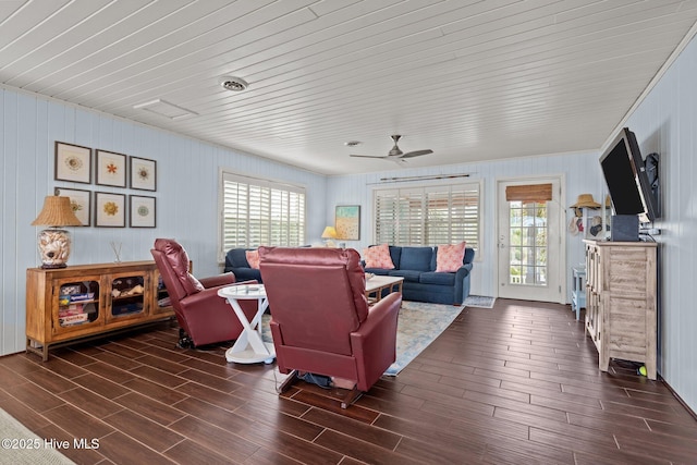 5709 Ocean Dr, Emerald Isle, NC 28594 - living room featuring healthy amount of natural light, dark wood-type flooring, and a ceiling fan