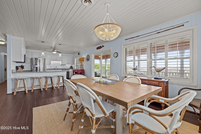 5709 Ocean Dr, Emerald Isle, NC 28594 - dining space with dark wood-style flooring and wooden ceiling