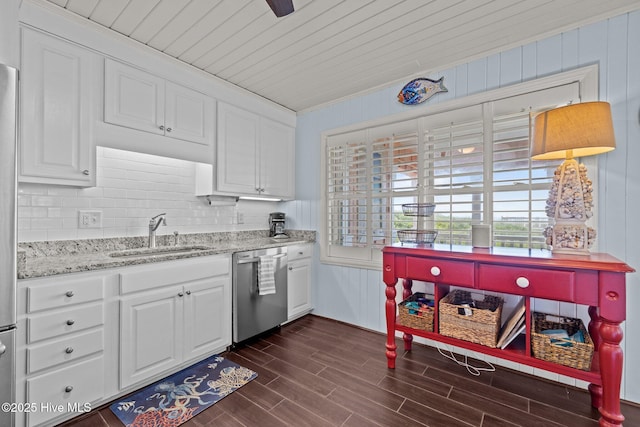 5709 Ocean Dr, Emerald Isle, NC 28594 - kitchen featuring a sink, dishwasher, white cabinetry, dark wood-type flooring, and light stone counters