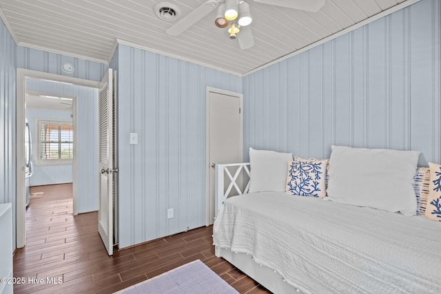 5709 Ocean Dr, Emerald Isle, NC 28594 - bedroom featuring crown molding, dark wood finished floors, and a ceiling fan