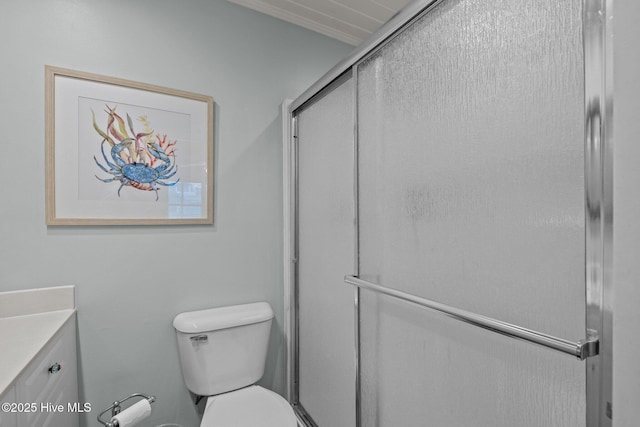 5709 Ocean Dr, Emerald Isle, NC 28594 - bathroom featuring vanity, a shower with shower door, and toilet