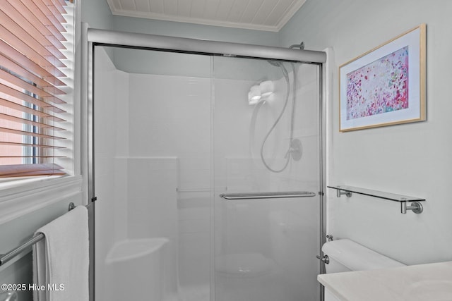 5709 Ocean Dr, Emerald Isle, NC 28594 - bathroom featuring ornamental molding, a shower stall, toilet, and vanity