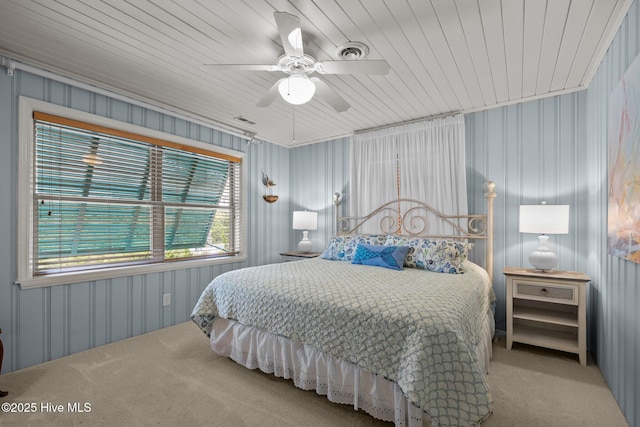 5709 Ocean Dr, Emerald Isle, NC 28594 - carpeted bedroom featuring a ceiling fan and wood ceiling