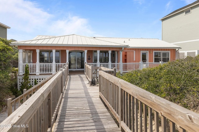 5709 Ocean Dr, Emerald Isle, NC 28594 - back of house featuring metal roof and a standing seam roof