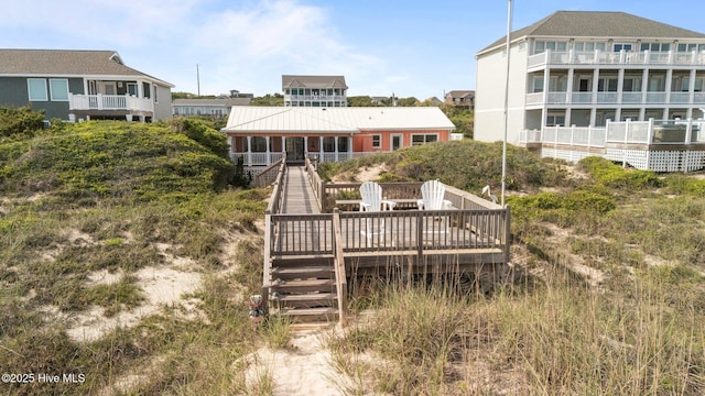 5709 Ocean Dr, Emerald Isle, NC 28594 - rear view of property with stairs and a deck