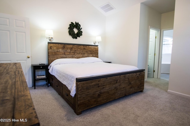 carpeted bedroom featuring lofted ceiling