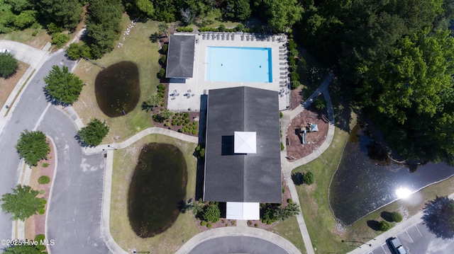 aerial view of property and surrounding area featuring a pool