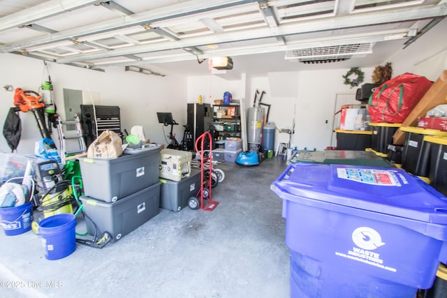 garage with gas water heater and a garage door opener