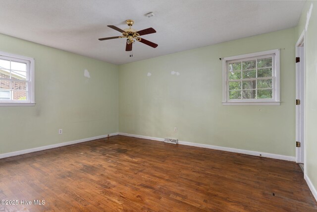 514 Mohican Trl, Wilmington, NC 28409 - spare room featuring wood finished floors, a ceiling fan, and baseboards
