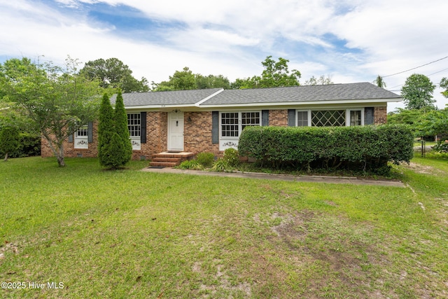 514 Mohican Trl, Wilmington, NC 28409 - ranch-style house with a front yard and brick siding
