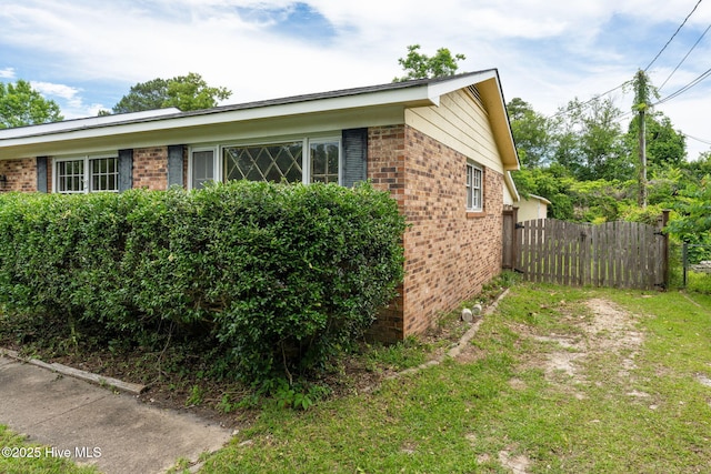 514 Mohican Trl, Wilmington, NC 28409 - view of home's exterior featuring brick siding