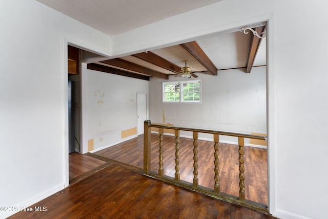 514 Mohican Trl, Wilmington, NC 28409 - spare room featuring hardwood / wood-style floors, baseboards, a ceiling fan, and beam ceiling