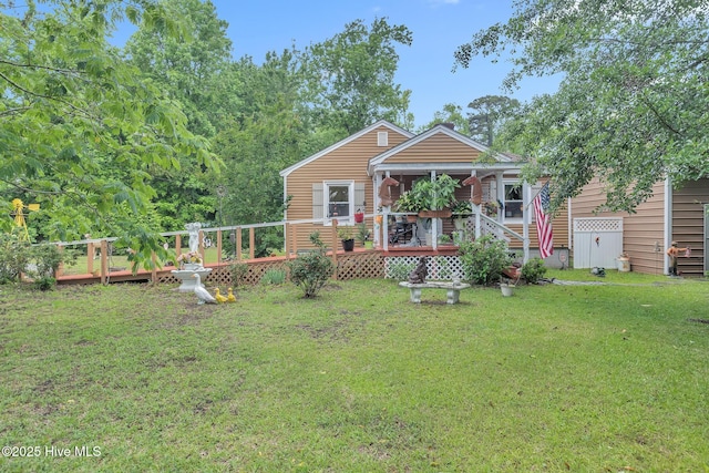 2601 Mayberry Loop Rd, Morehead City, NC 28557 - view of front of home featuring a wooden deck and a front lawn
