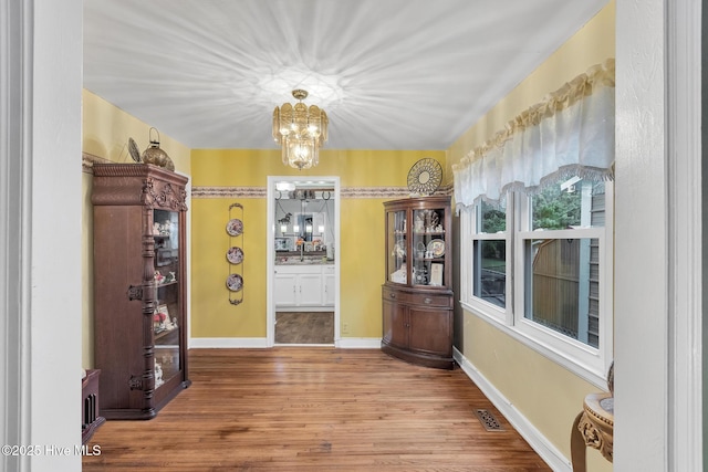 2601 Mayberry Loop Rd, Morehead City, NC 28557 - dining space featuring a chandelier and wood finished floors
