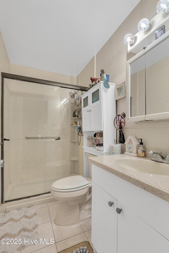 2601 Mayberry Loop Rd, Morehead City, NC 28557 - full bath with vanity, tile patterned flooring, a shower stall, and toilet