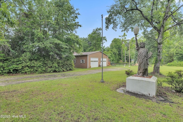 2601 Mayberry Loop Rd, Morehead City, NC 28557 - view of green lawn with a detached garage and an outdoor structure