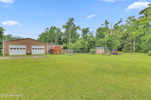 2601 Mayberry Loop Rd, Morehead City, NC 28557 - view of yard featuring an outdoor structure, a detached garage, and driveway