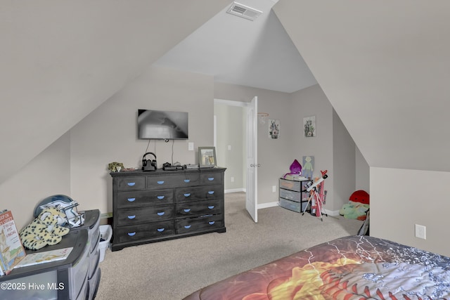 carpeted bedroom featuring lofted ceiling and baseboards