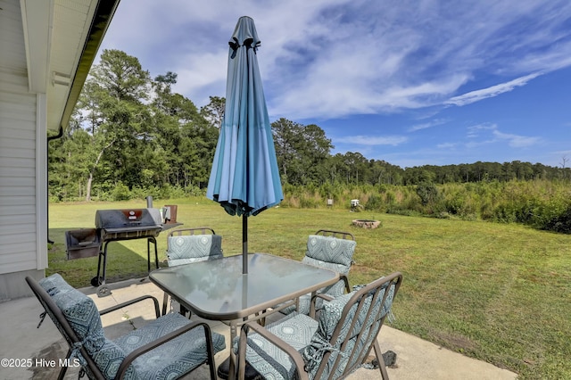 view of patio / terrace with outdoor dining area and a grill