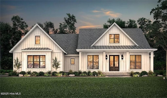 9 Mashie Ct SW, Carolina Shores, NC 28467 - modern farmhouse style home with a standing seam roof, french doors, board and batten siding, metal roof, and roof with shingles