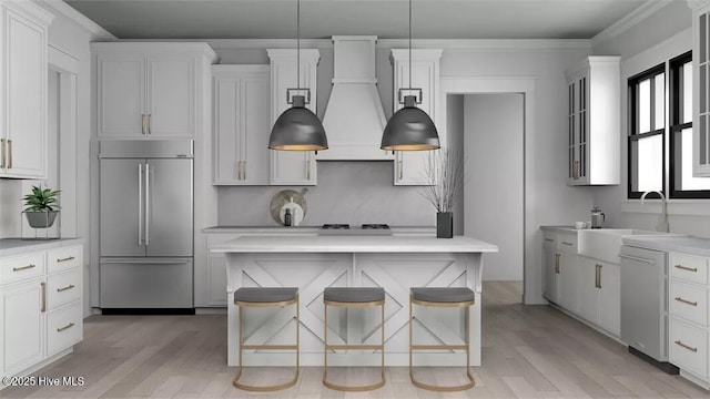 9 Mashie Ct SW, Carolina Shores, NC 28467 - kitchen with stainless steel built in fridge, custom range hood, a sink, light countertops, and light wood finished floors