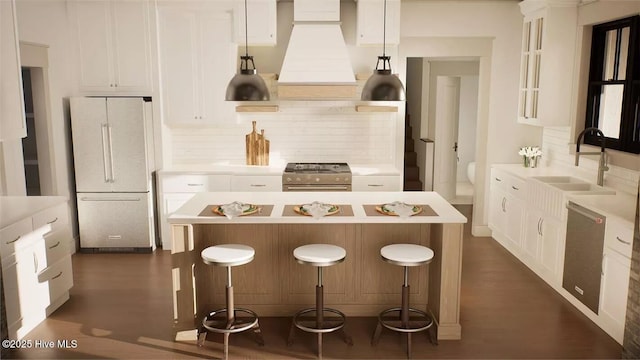 9 Mashie Ct SW, Carolina Shores, NC 28467 - kitchen with stainless steel appliances, a sink, a center island, light countertops, and premium range hood