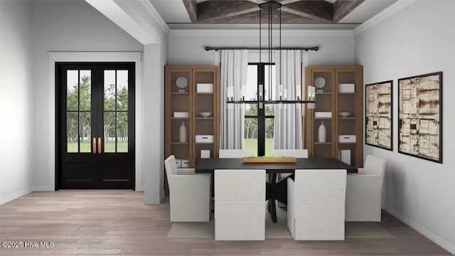 9 Mashie Ct SW, Carolina Shores, NC 28467 - unfurnished dining area featuring healthy amount of natural light, crown molding, wood finished floors, baseboards, and a high ceiling