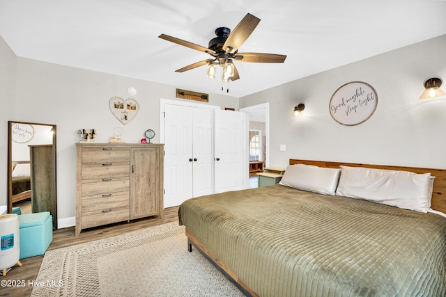 3446 Constable Way, Wilmington, NC 28405 - bedroom featuring wood finished floors, a closet, ceiling fan, and baseboards