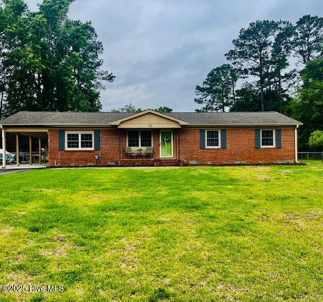 115 Oak Hills Dr, Rocky Point, NC 28457 - single story home featuring brick siding, an attached carport, and a front lawn