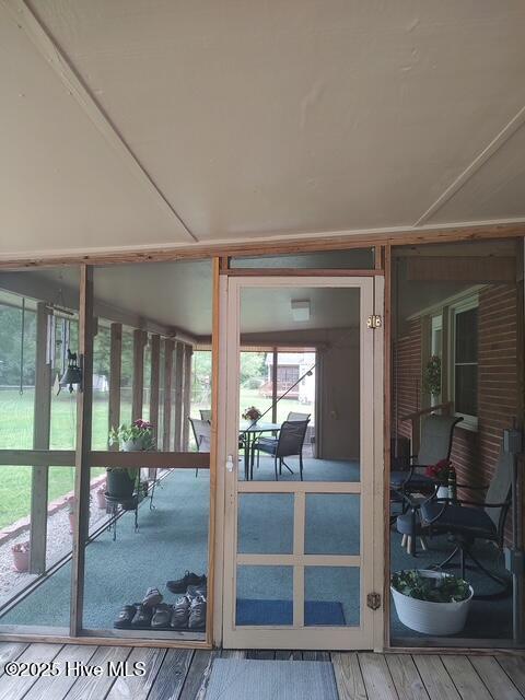 115 Oak Hills Dr, Rocky Point, NC 28457 - doorway to outside featuring wood finished floors