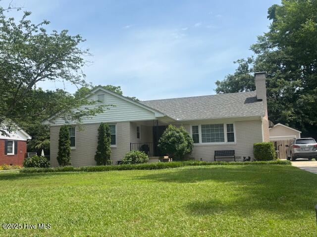 1209 Stockton Rd, Kinston, NC 28504 - ranch-style home with a front yard and a chimney