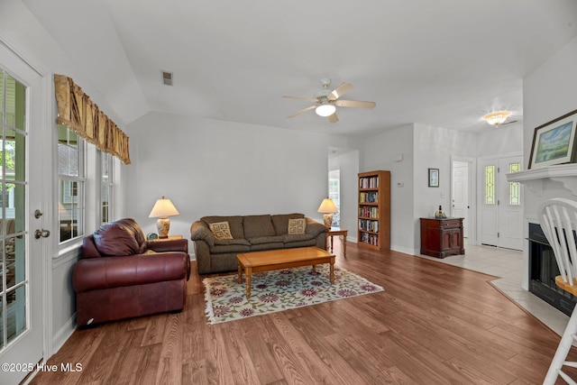 6112 Horton Rd, Oriental, NC 28571 - living area with a fireplace with raised hearth, wood finished floors, a ceiling fan, lofted ceiling, and baseboards