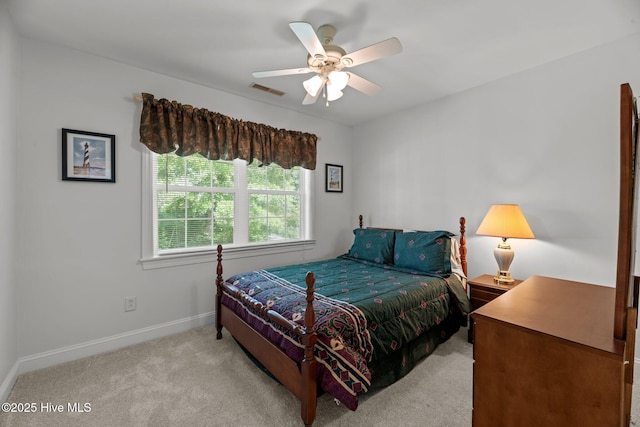 6112 Horton Rd, Oriental, NC 28571 - bedroom with light carpet, baseboards, and ceiling fan