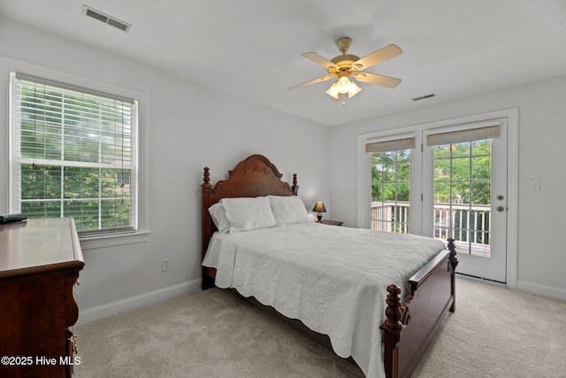 6112 Horton Rd, Oriental, NC 28571 - bedroom with multiple windows, access to outside, light carpet, and baseboards
